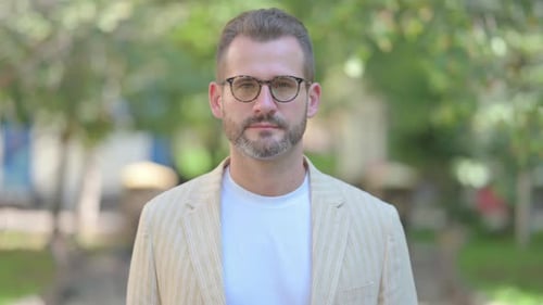 Adult Man in Glasses Looking at Camera