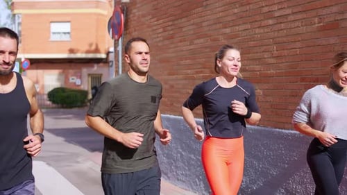 Group of Friends Jogging Together in the City