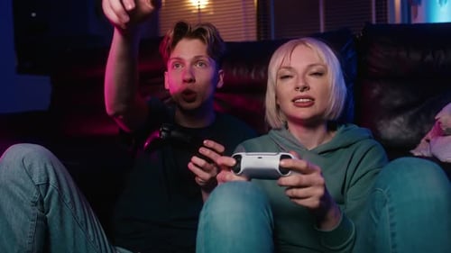Young Couple Playing Video Games at Home