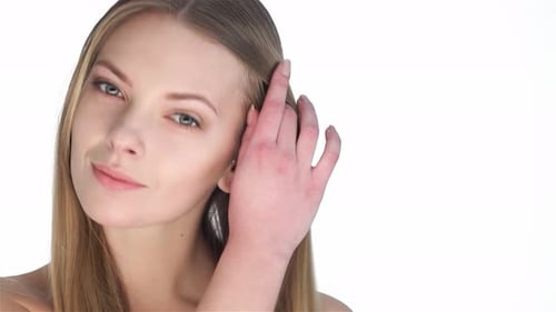 Beautiful Blonde Woman Posing in a Studio