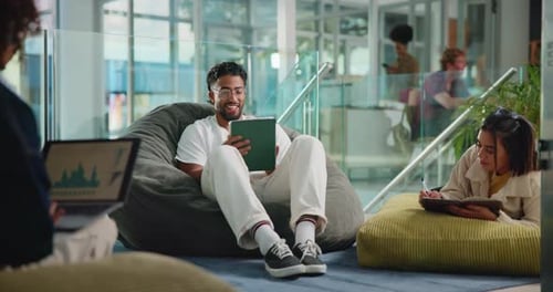 Tablet, smile and study lounge with man in college for education, platform and elearning