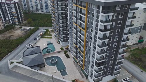 Aerial Video Elegant Facade of a New Complex Under a Cloudy Sky Perfect Architectural View