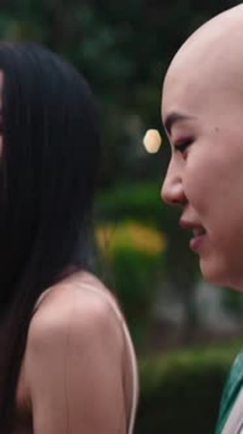 Asian Woman with Alopecia Enjoying Friendship Outdoors