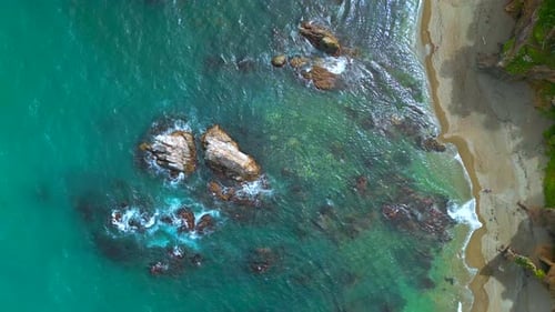 Top View of Beautiful Wild Coast with Rocks in Water Clip Coastline with Rocks and Waves Near Shore