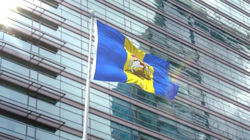 Moldova Flag Waving in Front of Modern Corporate Building