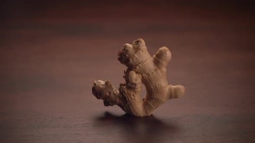 Fresh Ginger Root Displayed on a Wooden Surface Highlighting Its Natural Beauty and Freshness