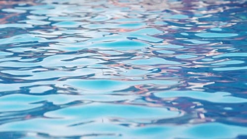 Pure Blue Water in Pool with Light Reflections