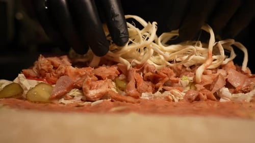 The Chef Puts Cheese on Shawarma in a Restaurant