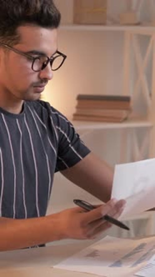 Vertical Financial Report Man Graphs Home Office
