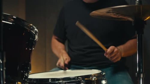 Expressive Drummer Young Man Professionally Playing on Dums in Studio Room Closeup Rock Metall Music