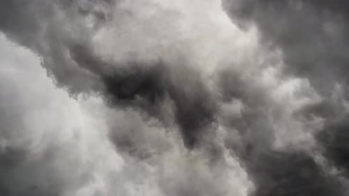 a thunderstorm inside the gray cumulus cloud and moved closer.