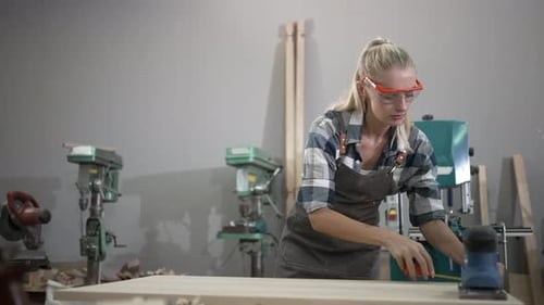 Carpenter is working at workshop.