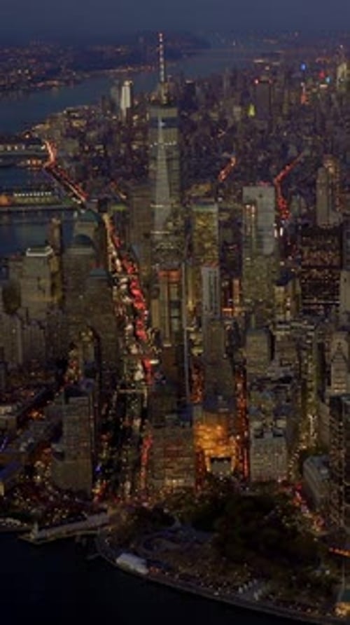 A Stunning Aerial View Capturing the Lights of New York City Illuminated at Nighttime
