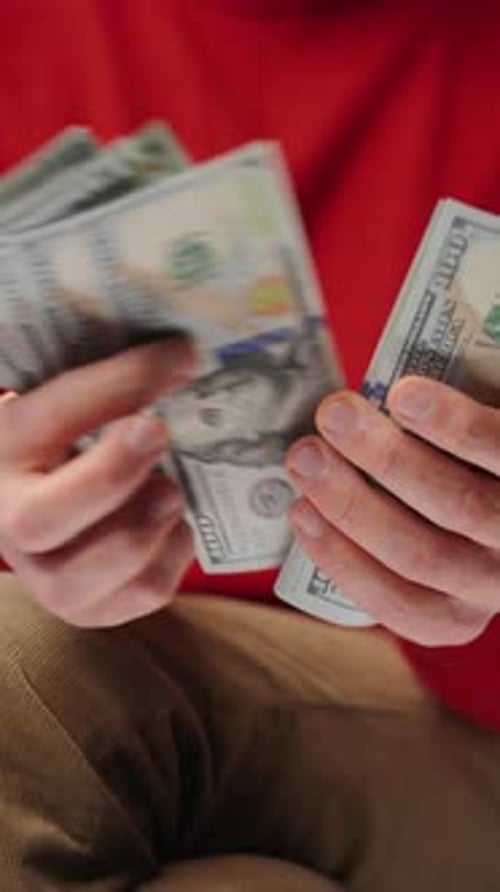 Counting Stack of US Hundred Dollar Bills