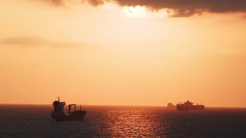 Stunning View of the Sunset Over the Sea with Clouds a Dry Cargo Ship is Moored on the Sea and