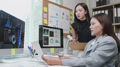 businesspeople working and brainstorming in office