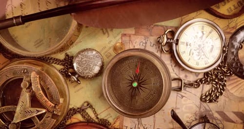 Vintage style travel and adventure. Vintage old compass and other vintage items on the table.