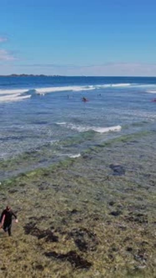 Surfers on the waves popular surfing beach in Canary Islands