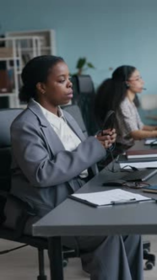 Female Operator Networking, Then Taking Headset and Putting It on Her Head