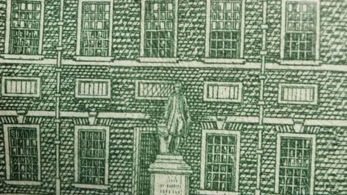 Independence Hall building on a hundred dollar bill. Dolly slider extreme close-up.