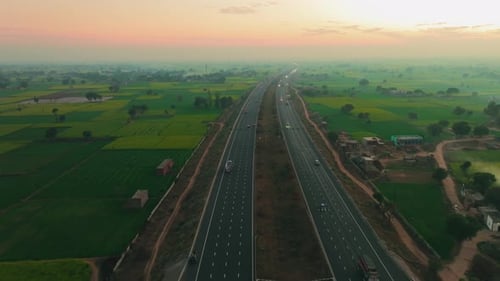 Aerial view of highway surrounded by fields, India.