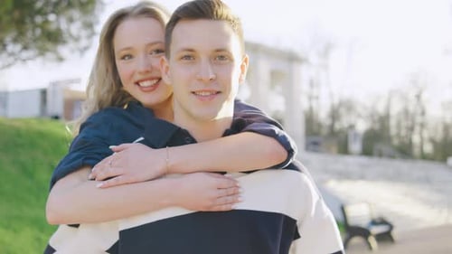 Portrait of Happy Couple Enjoys a Sunny Day Together in a Beautiful Park Capturing a Moment of Joy