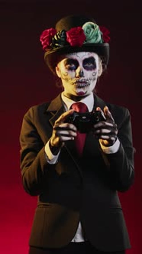 Vertical Video Model with Santa Muerte Body Art Playing Video Games
