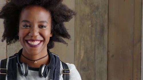 Smiling Young Woman with Headphones Posing