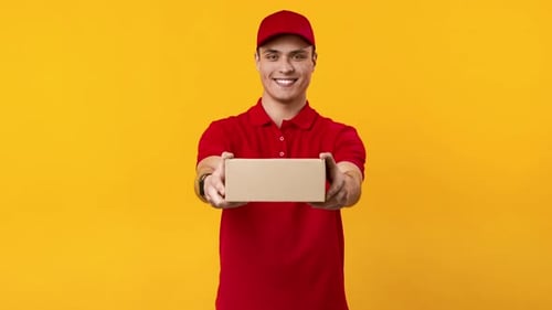 Man Delivers Small Package on Yellow Background