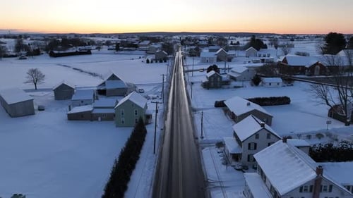 Snow Covered Rural Neighborhood at Winter Sunrise