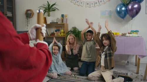 Anonymous Play Assistant Exploding Confetti Tube at Birthday Party