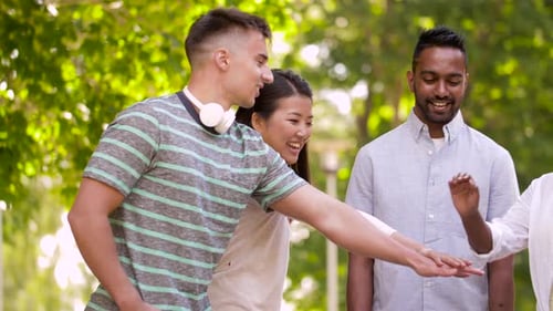 Unity, Friendship and International Concept - Group of Happy Smiling Friends Stacking