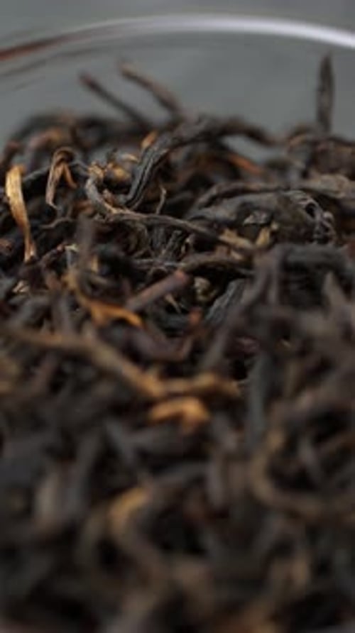 Close Up of Dried Tea Leaves in a Bowl Showcasing Their Vibrant Textures and Colors Media
