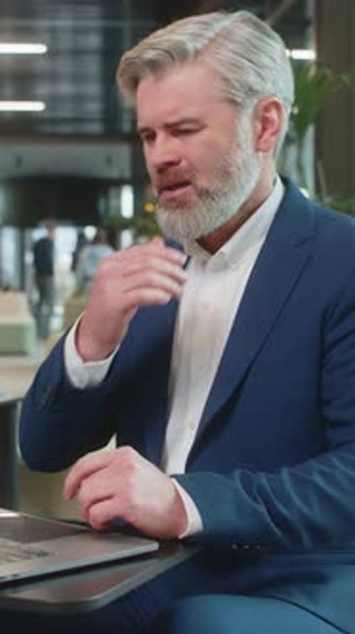 Sad Businessman Using Laptop Loses Becoming Shocked Sudden Lottery Results in Modern Hotel Lobby