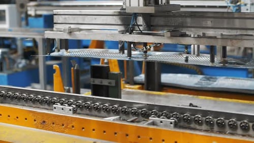 Automatical Manipulator Shifting Perforated Metal Sheets At Factory. Process Production Metal Det...