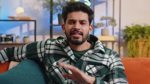 Man Talking to Camera on Couch