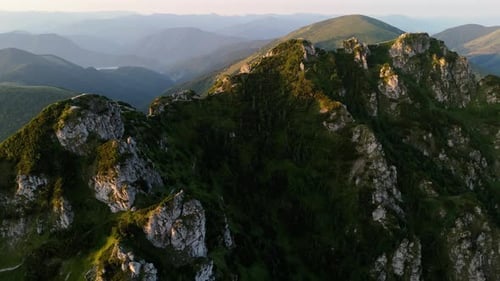 An Aerial Video Slow Dollyout Motion Revealing a Majestic Mountain Peak and Its Surroundings