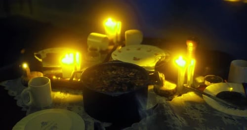 Flickering Candle Light on Dinner Table with Warm Glow