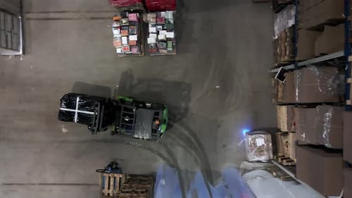 Top down view on forklift transport pallet ready to shipment in busy warehouse
