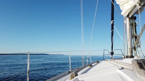 Great Lakes, Lake Michigan sailboat on clear water across lake or ocean no waves and clear skies. La