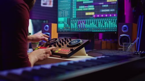 Musician Composing Song at Keyboard in Home Studio