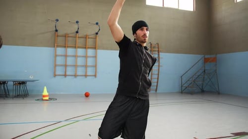 Young Adult Athlete warming up in Gymnasium