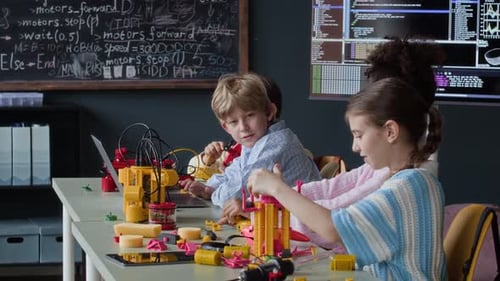 Multiethnic Schoolchildren Building Robots in Stem Class