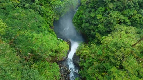 Aerial View of Majestic Waterfall in Costa Rica Tropical Rainforest with Mist
