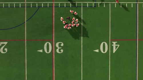 Aerial Top Down View of American Football Teams of Play at Night Time