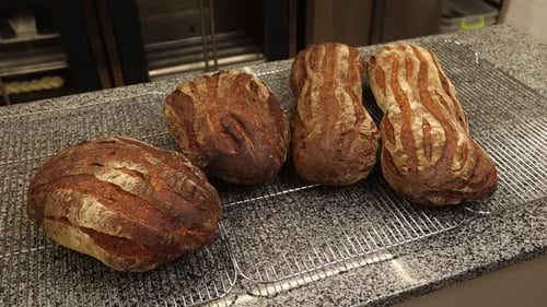 a chef makes bread in a bakery