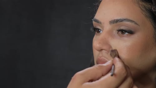 Makeup Application on Beautiful Model Close Up