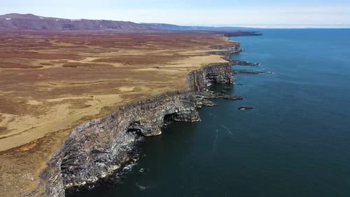 Aerial view of Krysuvikurberg cliffs along the coast in Iceland.