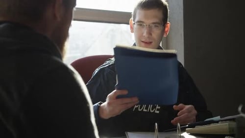 Police officer accusing suspect in precinct HD