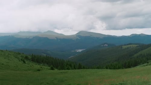 Scenic mountain landscape capturing peaks, valleys, and surrounding forests